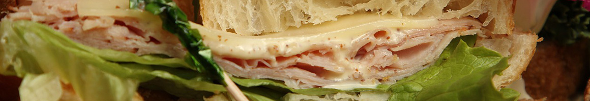 Eating Sandwich at Submarine City restaurant in Lockport, IL.